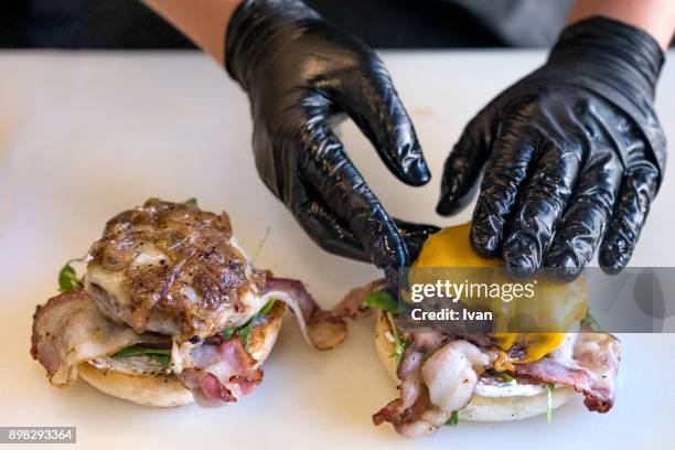 chef assembles, making burgers - greek chef stock pictures, royalty-free photos & images