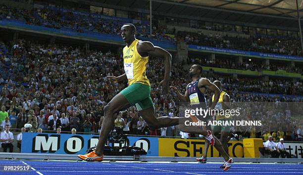 Jamaica's Usain Bolt wins the men's 100m final race of the 2009 IAAF Athletics World Championships ahead of US Tyson Gay and Jamaica's Asafa Powell...