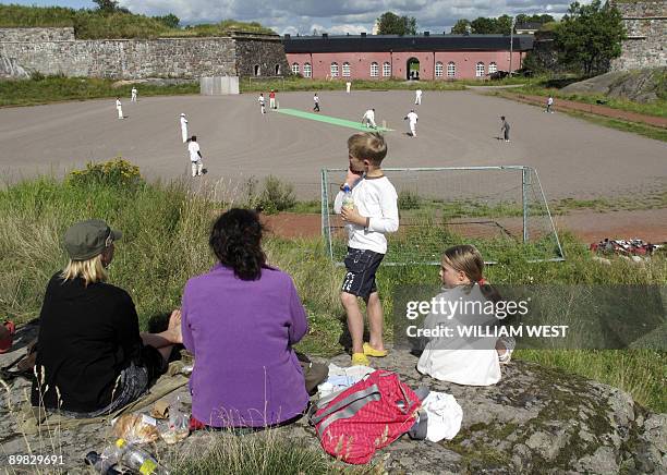 Cricket match in Finland is played on a gravel surface with a nylon mat at a Suomenlinna, a sea fortress, a ten minute ferry ride from downtown...