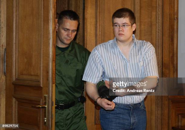 The accused Daniel V. Arrives in handcuffs at the Leipzig district court at the first day of the 'Michelle' trial on August 17, 2009 in Leipzig,...