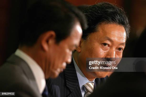 Yukio Hatoyama , President of the Democratic Party of Japan , speaks next to Taro Aso, President of the Liberal Democratic Party , during the six...