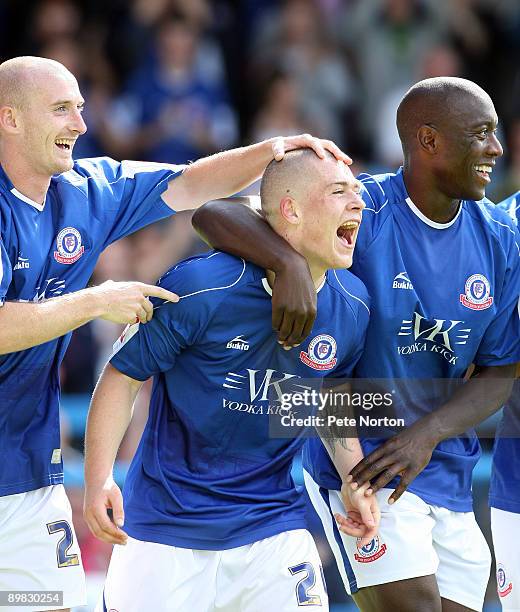 Donal McDermott of Chesterfield celebrates with teammates Drew Talbot and Kevin Austin after scoring his sides goal during the Coca Cola League Two...