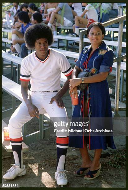 American singer Jermaine Jackson with Hazel Gordy, the daughter of Motown founder Berry Gordy, at a baseball match, circa 1973. The pair were married...