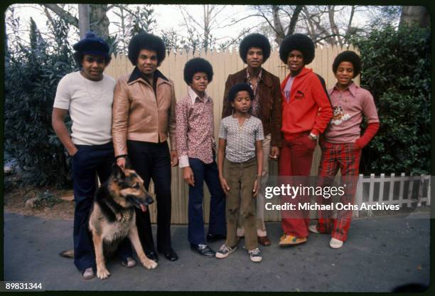 The Jackson brothers and their father Joseph pose for a portrait in the backyard of their home, Los Angeles, 1972. From left to right, Tito Jackson,...