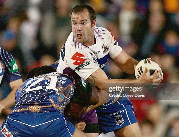 Scott Anderson of the Storm looks to pass during the round 23 NRL match between the Newcastle Knights and the Melbourne Storm at EnergyAustralia...