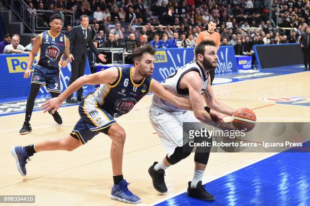Stefano Gentile of Segafredo competes with Diante Maurice Garrett and Aleksander Vujacic of Fiat during the LBA LegaBasket of serie A match between...