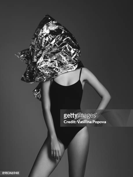 woman covered with foil - swimsuit models girls stock-fotos und bilder