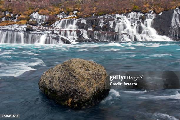 Hraunfossar, series of waterfalls pouring into the Hvita river in winter, Vesturland, Borgarfjorour, western Iceland.