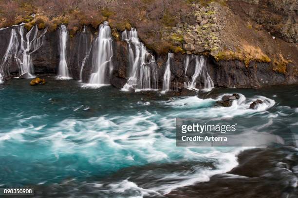 Hraunfossar, series of waterfalls pouring into the Hvita river in winter, Vesturland, Borgarfjorour, western Iceland.