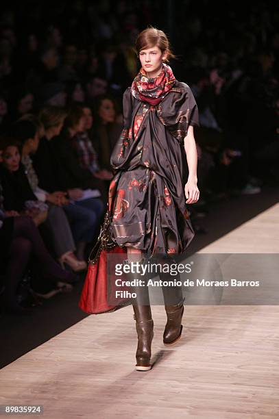 Model walks the runway at the Kenzo Ready-to-Wear A/W 2009 fashion show during Paris Fashion Week at Carreau du Temple on March 11, 2009 in Paris,...