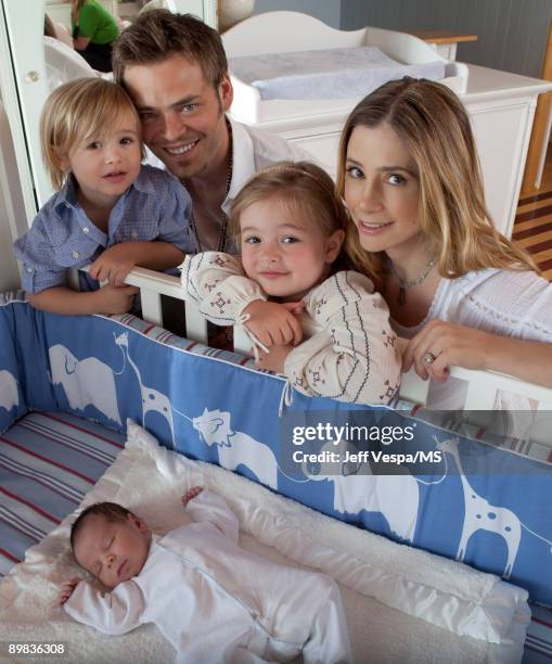 Christopher Backus and Mira Sorvino pose with son Johnny Backus, daughter Mattea Backus and newborn son Holden Backus during an at home photo shoot...