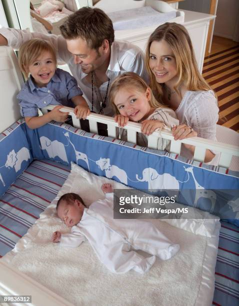 Christopher Backus and Mira Sorvino pose with son Johnny Backus, daughter Mattea Backus and newborn son Holden Backus during an at home photo shoot...