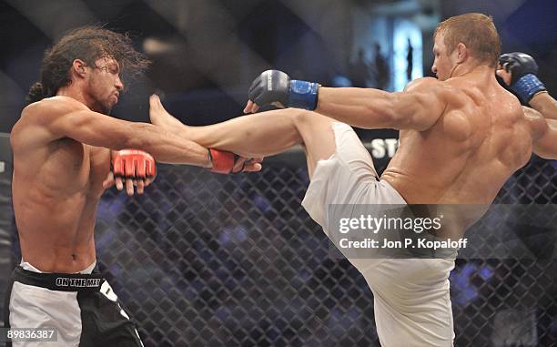 Justin Wilcox battles David Douglas at Strikeforce: Carano vs. Cyborg on August 15, 2009 in San Jose, California.