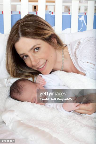 Mira Sorvino poses with newborn son Holden Backus during an at home photo shoot on July 1, 2009 in Malibu, California.