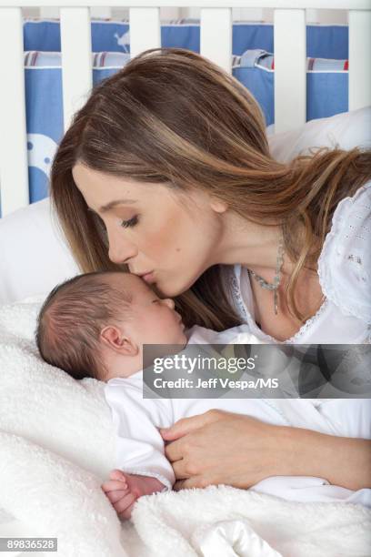 Mira Sorvino poses with newborn son Holden Backus during an at home photo shoot on July 1, 2009 in Malibu, California.