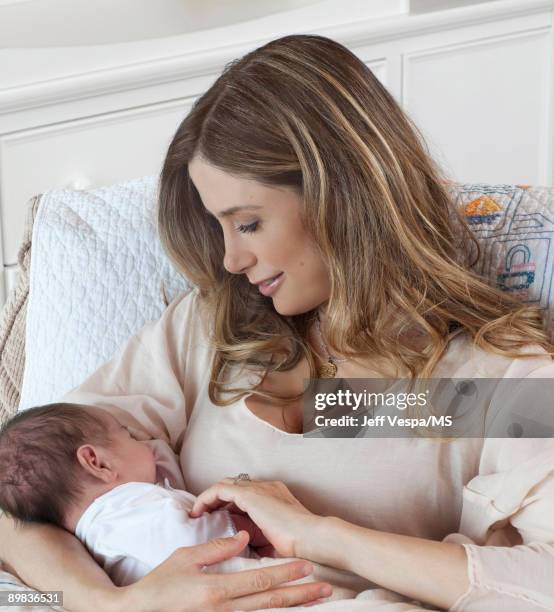 Mira Sorvino poses with newborn son Holden Backus during an at home photo shoot on July 1, 2009 in Malibu, California.