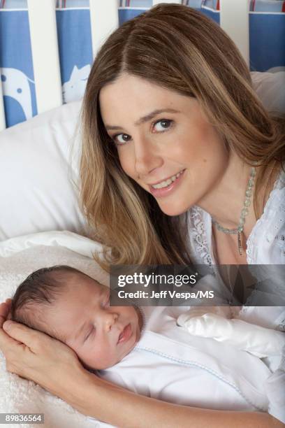 Mira Sorvino poses with newborn son Holden Backus during an at home photo shoot on July 1, 2009 in Malibu, California.