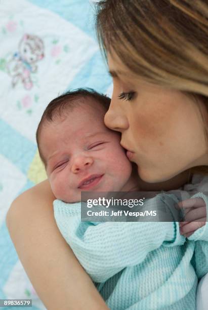 Mira Sorvino poses with newborn son Holden Backus during an at home photo shoot on July 1, 2009 in Malibu, California.