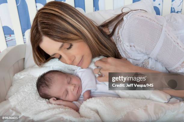 Mira Sorvino poses with newborn son Holden Backus during an at home photo shoot on July 1, 2009 in Malibu, California.