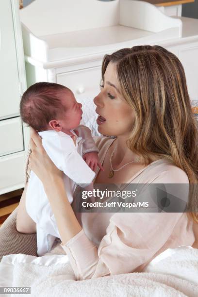 Mira Sorvino poses with newborn son Holden Backus during an at home photo shoot on July 1, 2009 in Malibu, California.