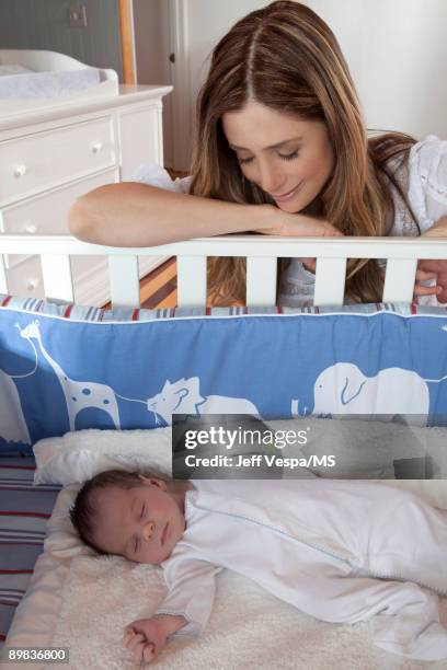 Mira Sorvino poses with newborn son Holden Backus during an at home photo shoot on July 1, 2009 in Malibu, California.