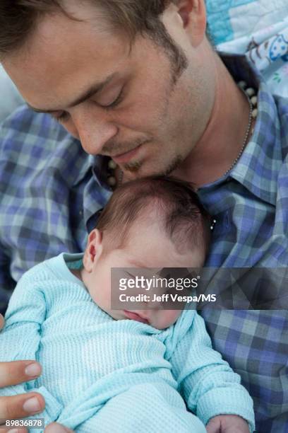 Christopher Backus poses with newborn son Holden Backus during an at home photo shoot on July 1, 2009 in Malibu, California.