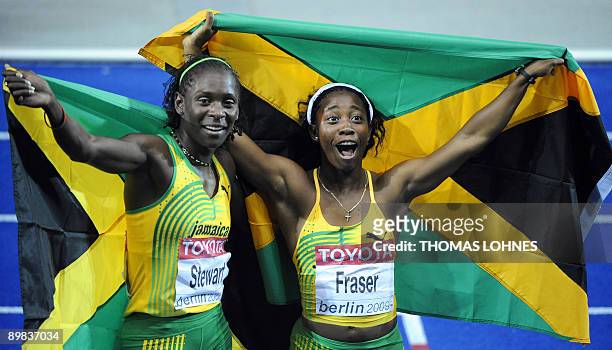 Jamaica's Shelly-Ann Fraser celebrates with Jamaica's Kerron Stewart their first and second place in the women's 100m final race of the 2009 IAAF...
