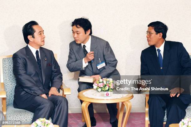 People's Republic of Kampuchea Prime Minister Hun Sen talks with Democratic Socialist Party leader Keigo Ouchi during their meeting on June 21, 1992...