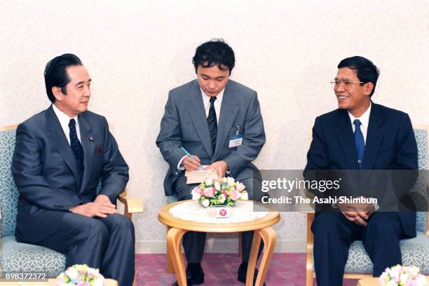 People's Republic of Kampuchea Prime Minister Hun Sen talks with Democratic Socialist Party leader Keigo Ouchi during their meeting on June 21, 1992...