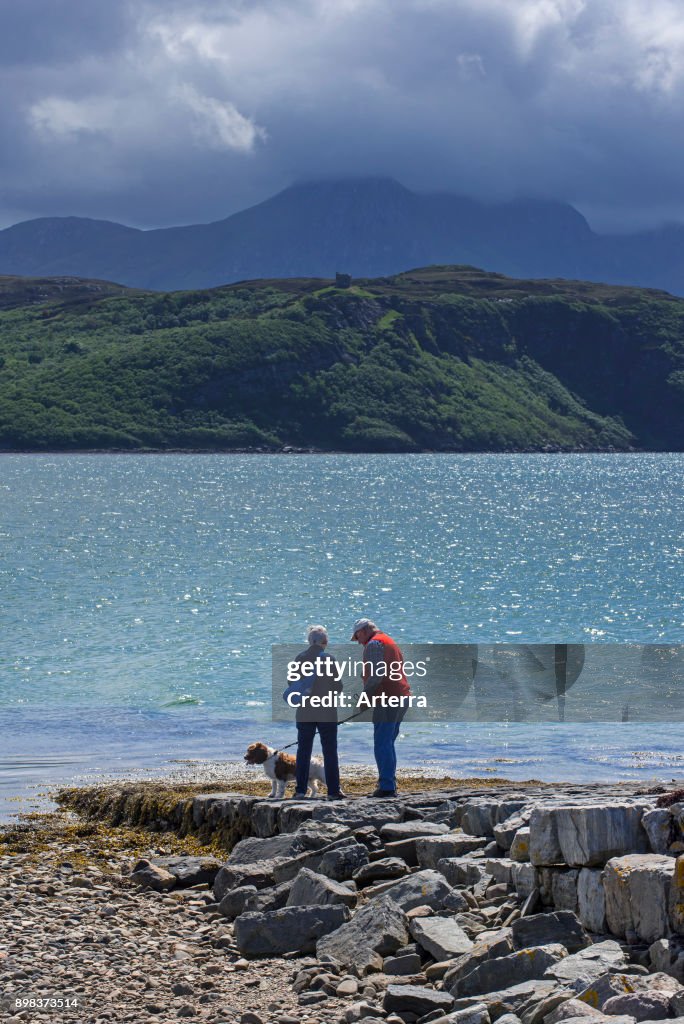 Tourists looking over Ben Loyal and Kyle of Tongue.