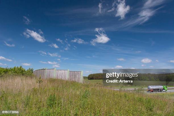 Wildlife bridge / animals overpass / wildlife crossing / ecoduct over highway connecting animal habitats and avoiding collisions with vehicles.