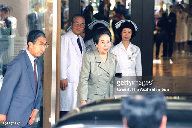 Princess Yuriko of Mikasa leaves the St. Luke's International Hospital with Prince Mikasa on June 25, 1992 in Tokyo, Japan.