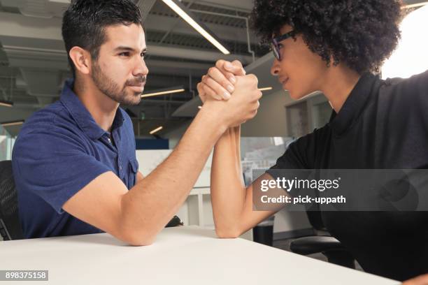 arm wrestle - female wrestling holds stock pictures, royalty-free photos & images