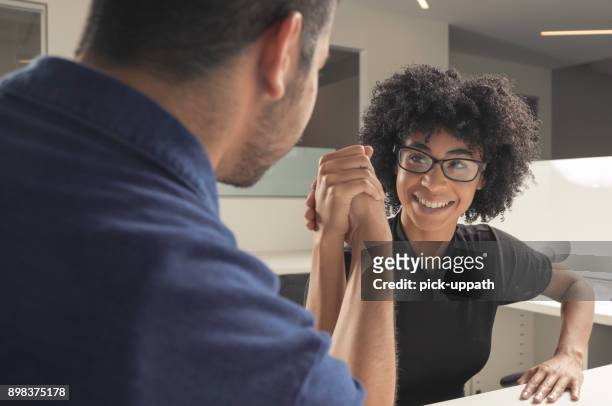 arm wrestle - female wrestling holds stock pictures, royalty-free photos & images