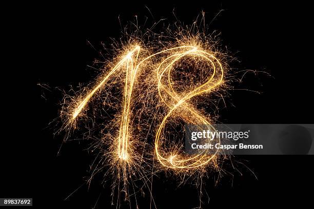 the number 18 written with a sparkler - number 18 stock pictures, royalty-free photos & images