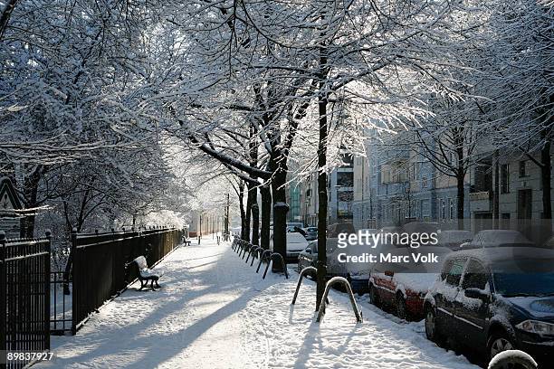 a residential street covered in snow, berlin, germany - winter berlin bildbanksfoton och bilder