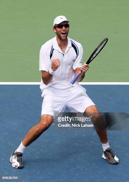 Ivo Karlovic of Croatia celebrates winning match point against Gael Monfils of France during day one of the Western & Southern Financial Group...