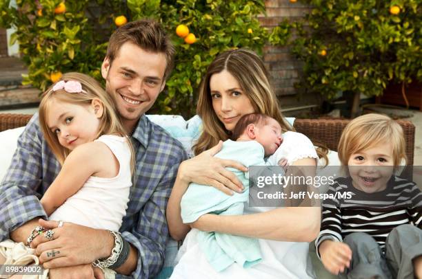 Christopher Backus and Mira Sorvino pose with daughter Mattea Backus, newborn son Holden Backus and son Johnny Backus during an at home photo shoot...