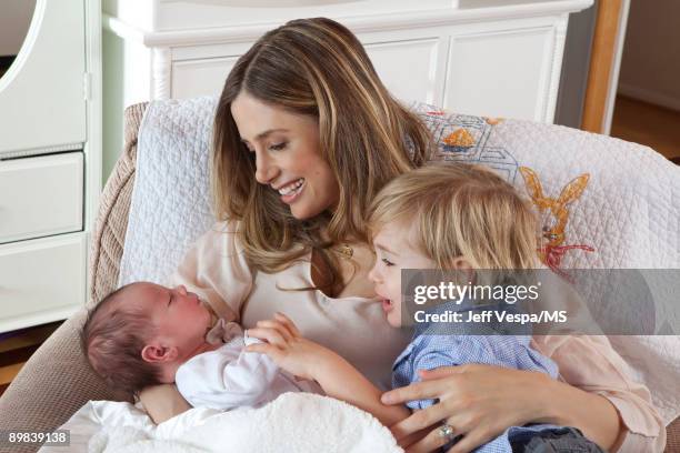 Mira Sorvino poses with sons Holden Backus and Johnny Backus during an at home photo shoot on July 1, 2009 in Malibu, California.