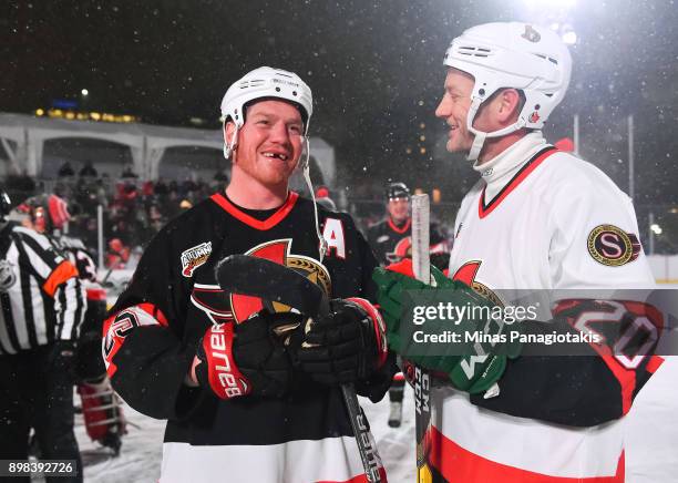 Ottawa Senators alumni Chris Neil shares a laugh with Magnus Arvedson during the 2017 Scotiabank NHL100 Classic Ottawa Senators Alumni Game on...