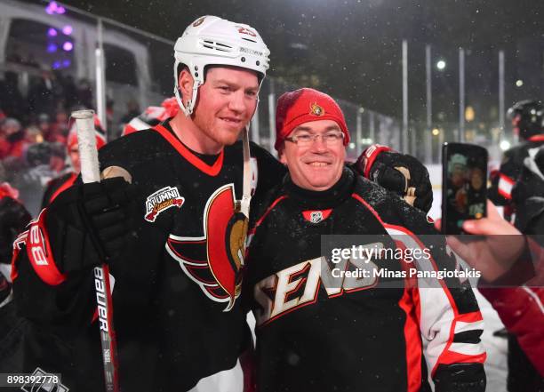 Ottawa Senators alumni Chris Neil poses with a fan for a photo during the 2017 Scotiabank NHL100 Classic Ottawa Senators Alumni Game on Parliament...