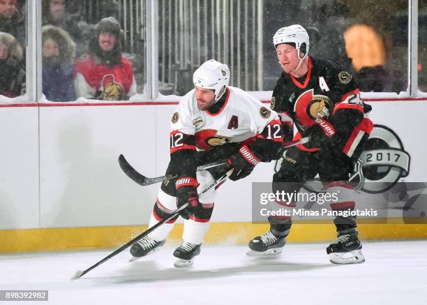 Ottawa Senators alumni Mike Fisher battles for a loose puck with Chris Neil during the 2017 Scotiabank NHL100 Classic Ottawa Senators Alumni Game on...