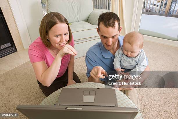 woman signing the word 'duck' in american sign language while sitting with her family - sitting duck stock pictures, royalty-free photos & images