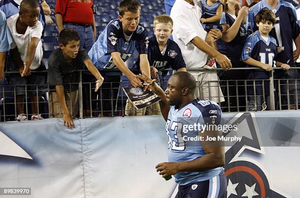 Alge Crumpler of the Tennessee Titans shakes hands with fans after a game against the Tampa Bay Buccaneers during a preseason NFL game at LP Field on...