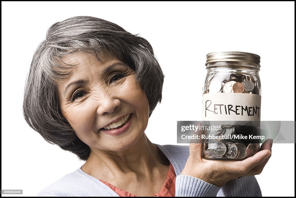 Woman with a jar full of coins