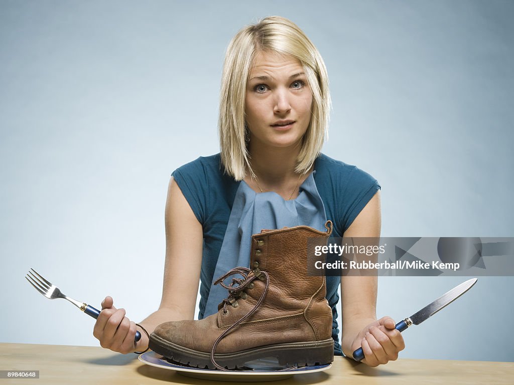 Woman eating a boot