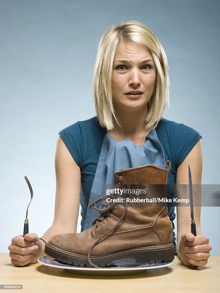 Woman eating a boot