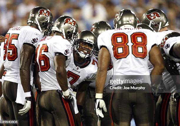 Byron Leftwich of the Tampa Bay Buccaneers talks to his team in the huddle against the Tennessee Titans during a preseason NFL game at LP Field on...
