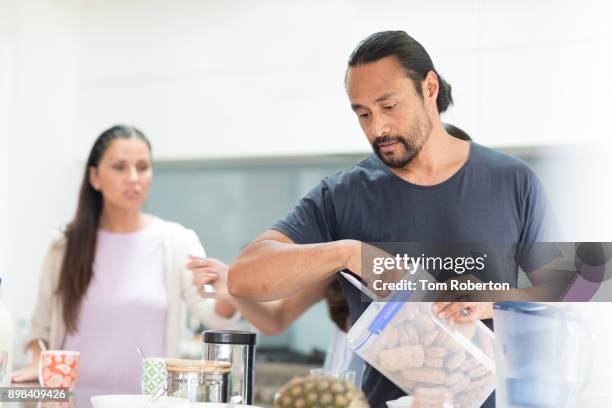 pacific island man breakfast on kitchen bench - auckland island shag stock pictures, royalty-free photos & images