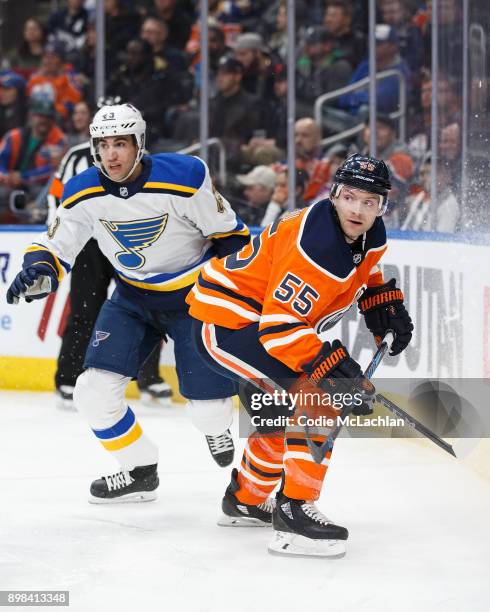 Mark Letestu of the Edmonton Oilers battles against Jordan Schmaltz of the St. Louis Blues at Rogers Place on December 21, 2017 in Edmonton, Canada.